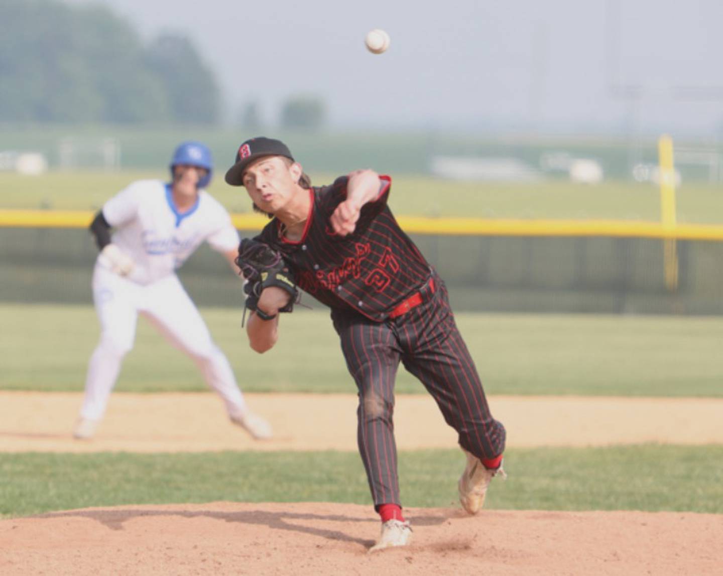 Benet's Jake Rifenburg delivers a pitch against Burlington Central at the Class 3A Kaneland Sectional Semi Final on Thursday, June 5, 2025 in Maple Park.
