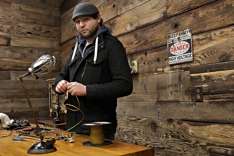 Nathan Rock of Industrial Artifacts is seen Friday at his shop in DeKalb.