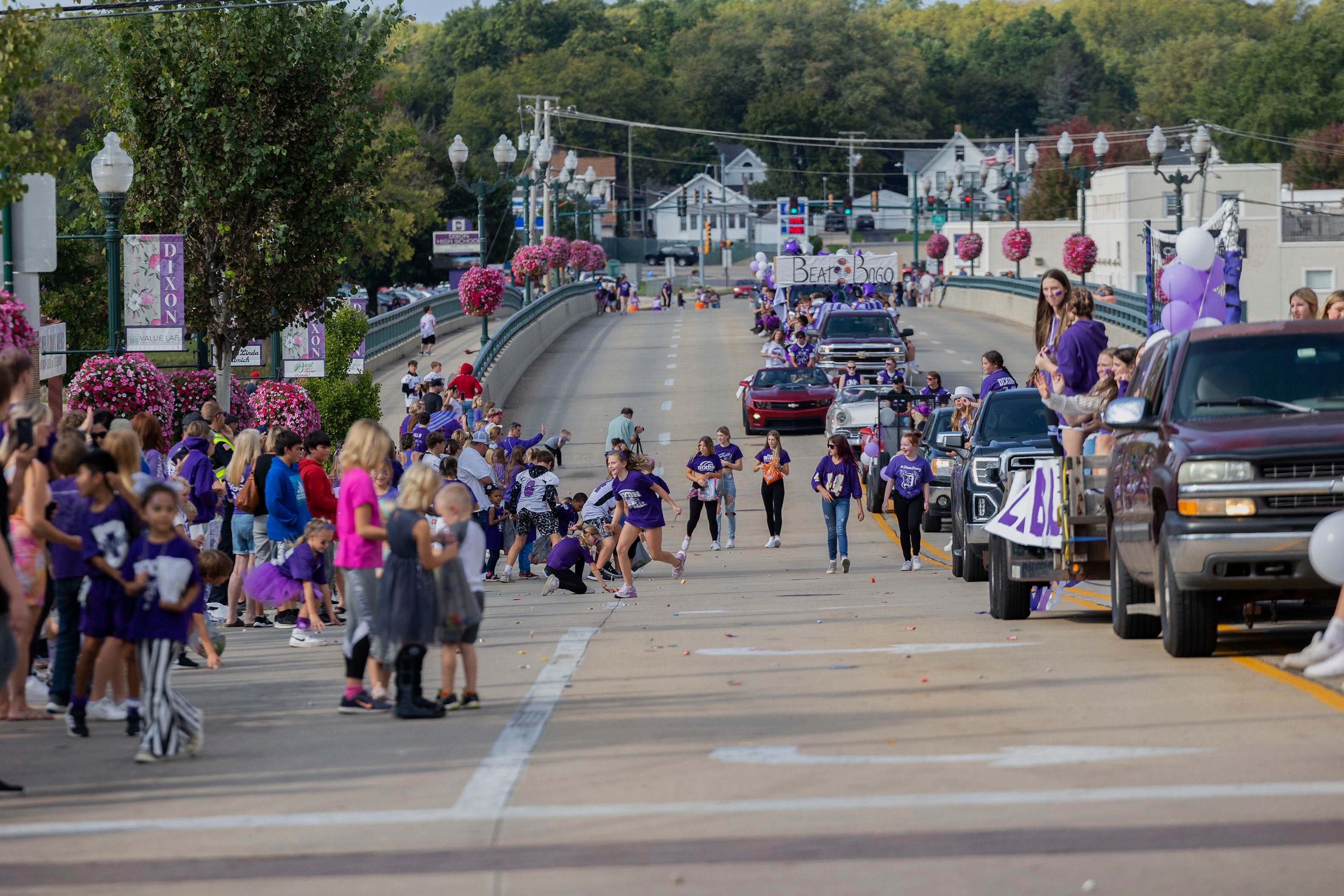 Kids scramble around for candy thrown from floats Friday, Sept. 29, 2023 during the Dixon homecoming parade.