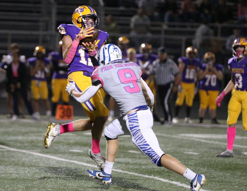 Mendota's Aden Tilman makes a catch over Princeotn's Aurthur Burden on Friday, Oct. 11, 2024 at Mendota High School.