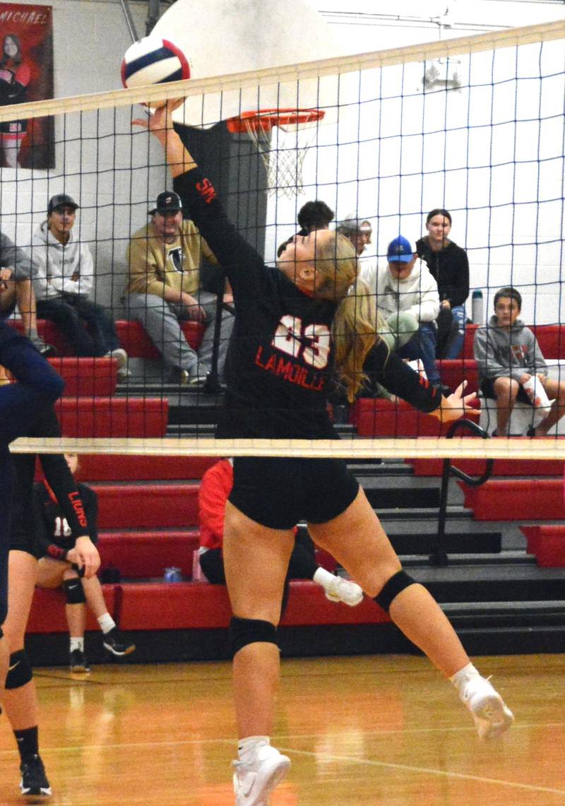 LaMoille senior Taylor Wamhoff makes a play at the net Tuesday night at Dean Madsen Gymnasium. The Lions scored a senior night victory over DePue for their first win of the season.