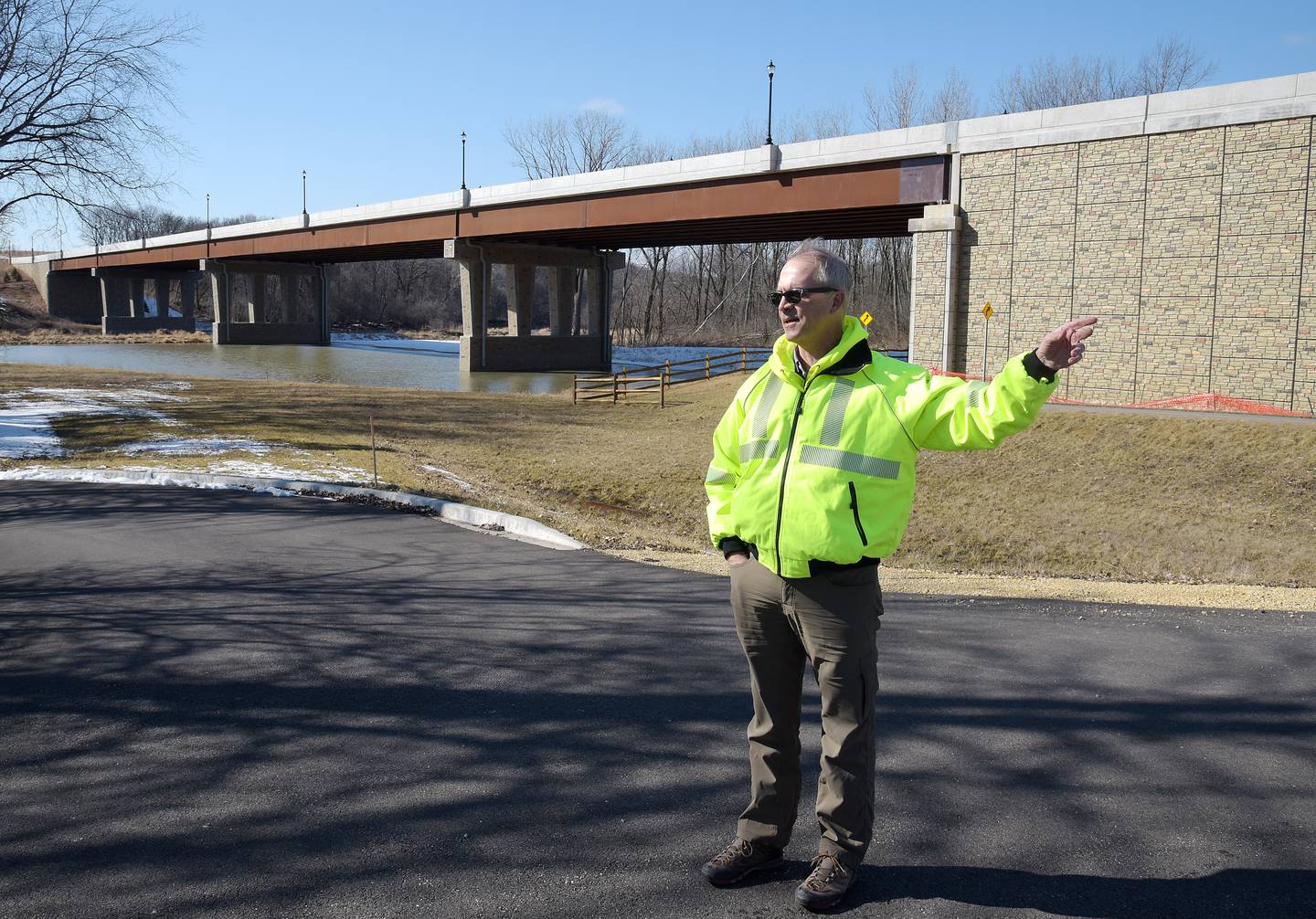 Carl Schoedel, Kane County Director of Transportation, leads a tour of the progress on Longmeadow Parkway. While the bridge over the Fox River is complete, the road just to the east is still under construction.