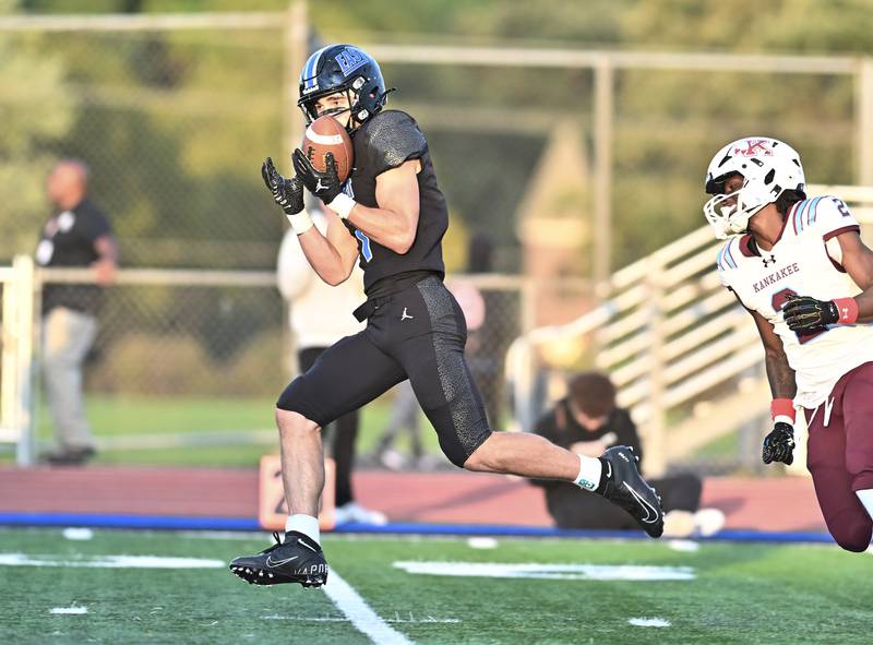 Lincoln Way East's Blaise LaVista (1) catches a deep pass against Kankakee's Ezekiel Sherrod Jr. (2) during the non-conference game on Friday, Sept. 05, 2025, at Frankfort.