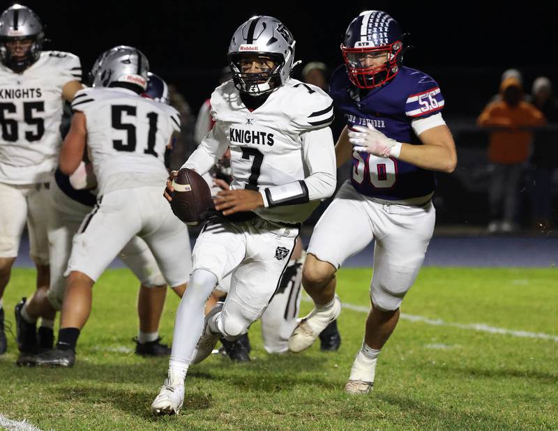 Kaneland's Jalen Carter gets by Belvidere North's AJ Tauscher Friday, Nov. 7, 2025, during their Class 5A second round playoff game at Belvidere North High School.
