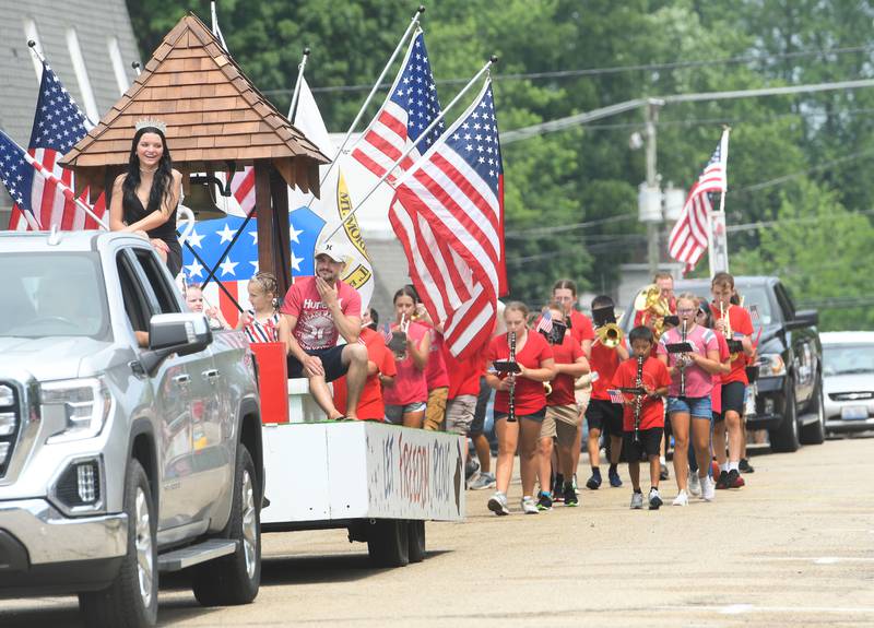2021 Let Freedom Ring Queen Katelyn Bowers rides with this year's Little Miss and Mister ahead of the Oregon school band during the Let Freedom Ring Grand Parade in Mt. Morris on July 4.