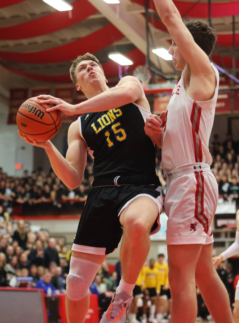 Lyons' Graham Smith (15) drives to the basket during the boys 4A varsity sectional semi-final game between Hinsdale Central and Lyons Township high schools in Hinsdale on Wednesday, March 1, 2023.