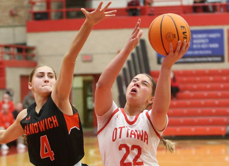Ottawa's Marlie Orlandi lets go of a shot over Sandwich's Hannah Treptow on Monday, Jan. 27, 2025 in Kingman Gym at Ottawa High School.