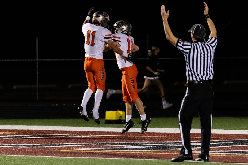 After scoring a touchdown Minooka's Brady Hairald celebrates with his teammate Kooper Fisher during the Oct. 11 game held at Plainfield North.