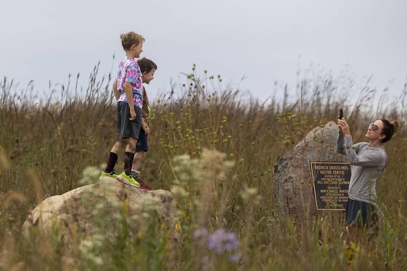 Elliott (left), 8, and Calvin Doerder, 6, of the Quad Cities area have a picture taken by mom while attending at Nachusa’s Autumn on the Prairie Saturday, Sept. 20, 2025.