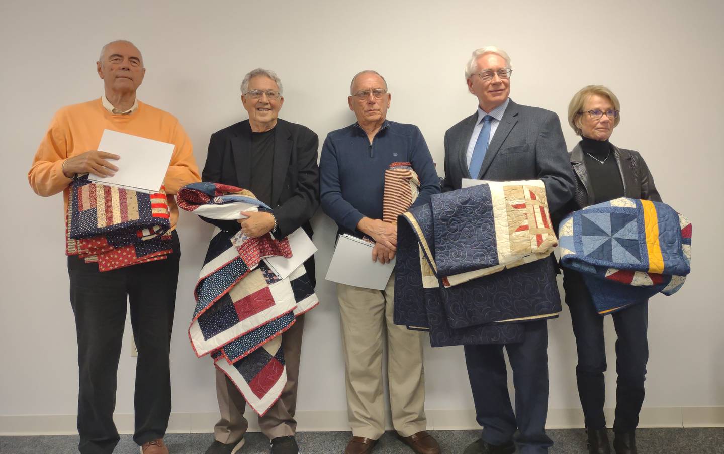 (From left) Veterans Nelson Nussbaum, Boyd Palmer, Ralph Maubach and Reed Wilson accepted Quilts of Valor, along with Deb Dahl, who received a Quilt of Valor in honor of the late Sen. Gary Dahl.