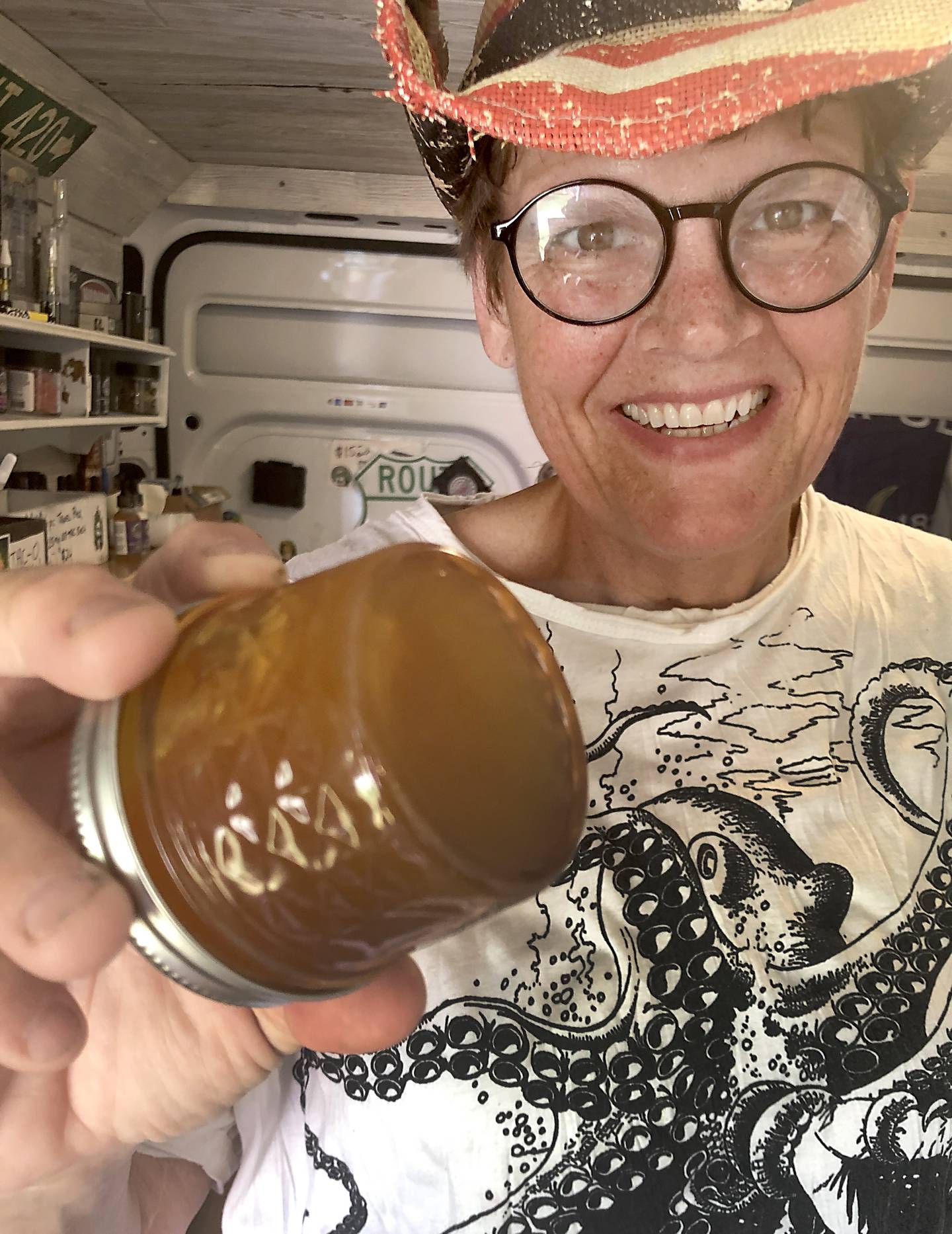 A jar of pure raw CBD oil, grown at Stacy McCaskill's Hempstock Pharm, is shown here at the McHenry County Fair on Aug. 6, 2022. The oil looks like honey, is slightly sticky and smells which reminds of its cousin, the marijuana plant.
