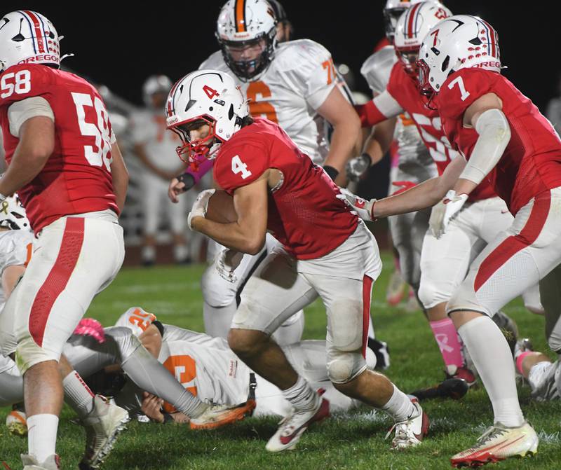 Oregon's Jakobi Donagen (4) runs with the ball against Winnebago on Friday, Oct. 17, 2025 at Landers-Loomis Field in Oregon.