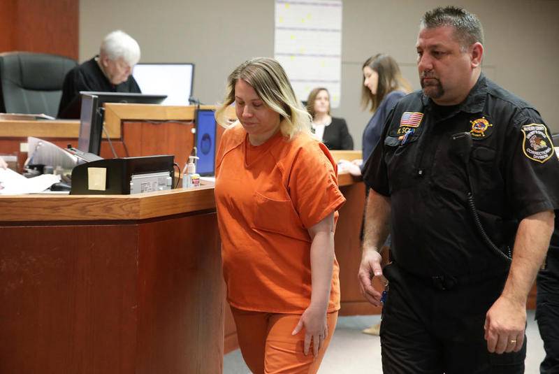 JoAnn Cunningham leaves courtroom 302 on Feb. 27 after a status hearing with McHenry County Judge Robert Wilbrandt at the McHenry County Courthouse in Woodstock. In December, she plead guilty to killing her 5-year-old son, AJ Freund.