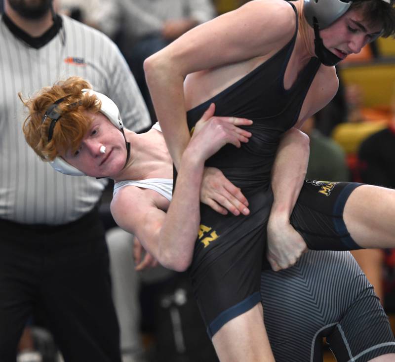 Fulton's Coltin Hartman throws Yorkville Christian's Davin Torza in the championship match at 106 pounds at the Polo Wrestling Invitational on Saturday, Jan, 10, 2026 at Polo High School.