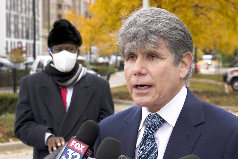 FILE - Former Illinois Gov. Rod Blagojevich, right, speaks, Oct. 21, 2020, during a news conference in Chicago. (AP Photo/Charles Rex Arbogast, File)