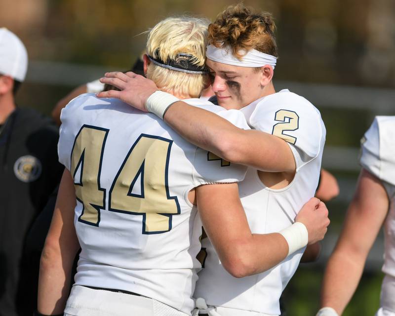 Sycamore’s Caden O'donnell (22) and teammate Thatcher Friedrichs (2) embrace after their season ends on Saturday Nov. 4, 2023, as they took on Morgan Park at Gately Stadium in Chicago.