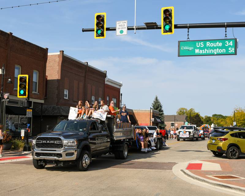 Oswego’s Athletic training students and staff members enjoy a ride during the homecoming parade held on Sunday Sept. 15, 2024, that traveled through downtown Oswego.