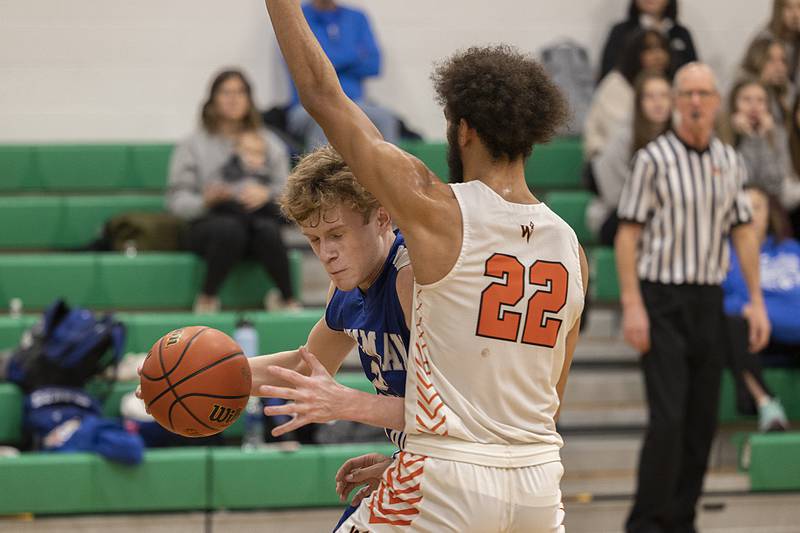 Newman’s Lucas Simpson works below the basket against Winnebago’s Ray Maurchie Saturday, Jan. 7, 2023 at the Rock Falls Shootout.
