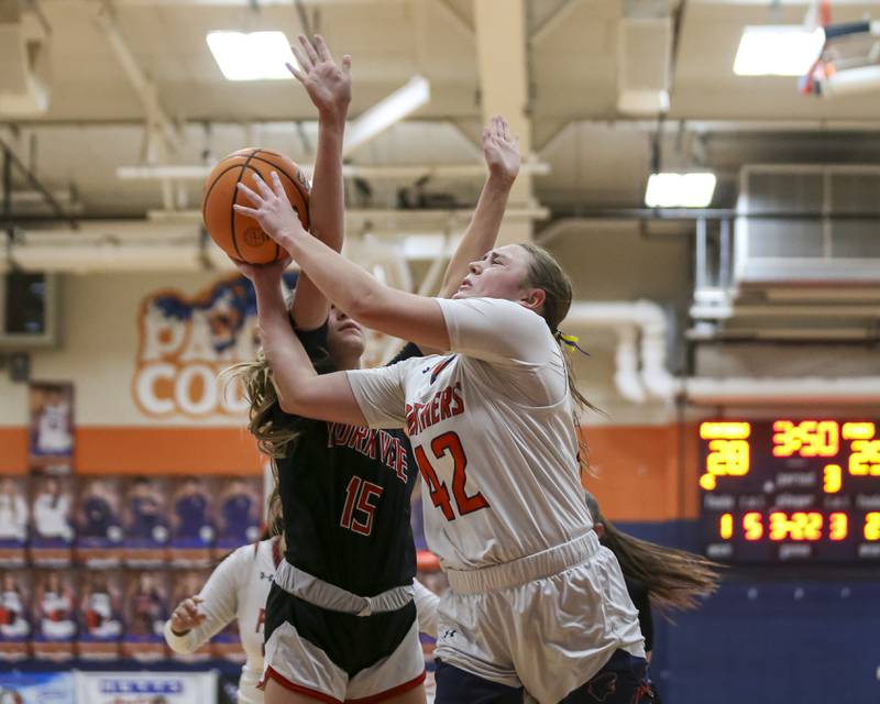 Oswego's Kendall Grant (42) is fouled underneath the basket during their basketball game between Yorkville at Oswego, Feb 7, 2026 in Oswego.
