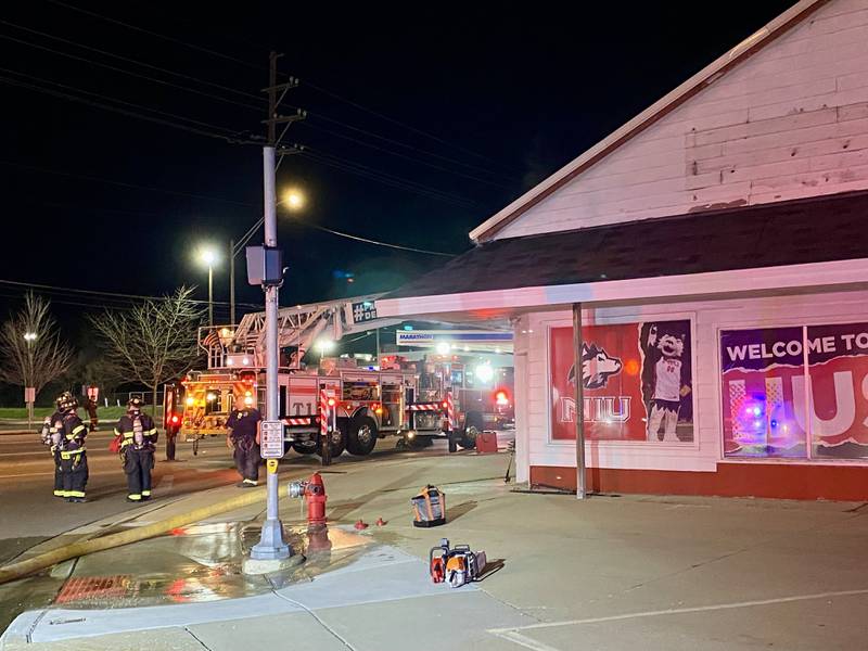 Crews from the DeKalb Fire Department respond to a structure fire around 11 p.m. Tuesday, March 19, 2024, at the now vacant building that once held Illini Tire Co., which closed in 2018.