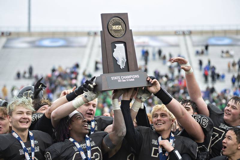 Lena-Winslow celebrates its Class 1A state championship win over Carrollton on Friday, Nov. 26, 2021, at Northern Illinois University's Huskie Stadium.