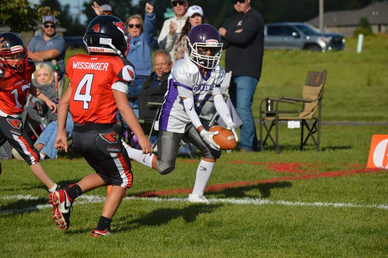 Rochelle's Rowan Villalobos reaches the ball into the end zone for a touchdown during a fifth-grade junior tackle game with Stillman Valley on Sunday, Sept. 7, 2025. Rochelle won 30-0.