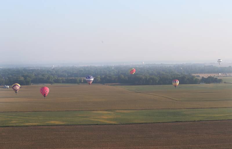 Hot air balloons fly south of Princeton during the 52nd annual Homestead Festival on Saturday, Sept. 9, 2023 in Princeton.