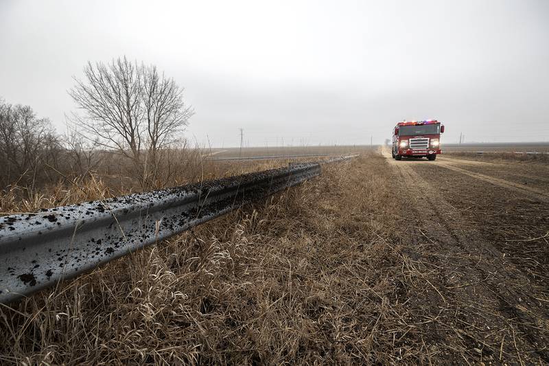 Covered in mud but otherwise undamaged, the semi-truck cleared Bollman Road  before resting in an empty field Monday, Feb. 3, 2025.
