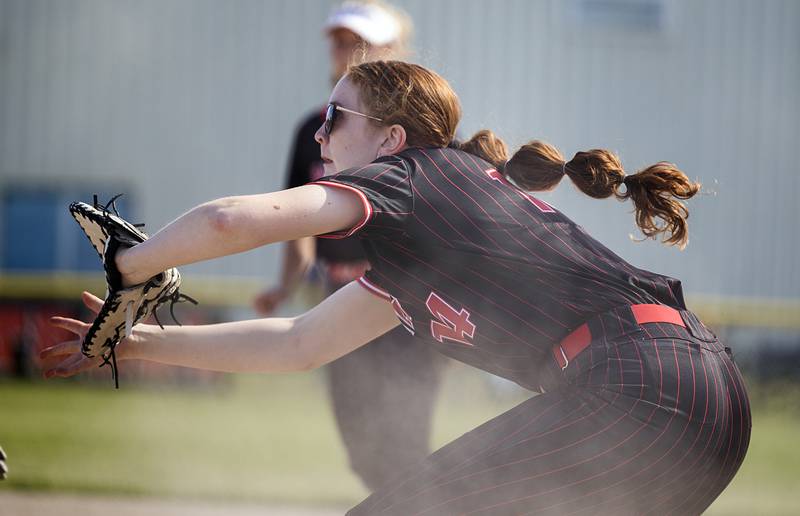 Erie-Prophetstown’s Eden Jensen takes a throw at first to complete a double play against Morrison Thursday, May 14, 2026.