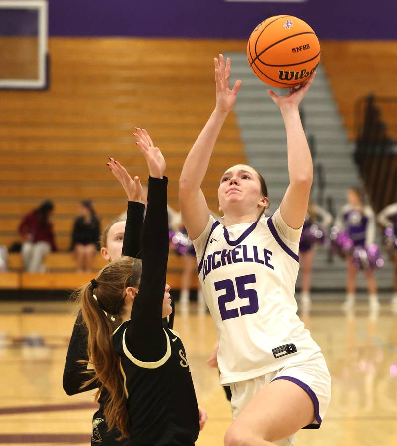 Rochelle's Jaydin Dickey goes to the basket against Sycamore's Cortni Kruizenga Friday, Dec. 5, 2025, during their game at Rochelle High School.