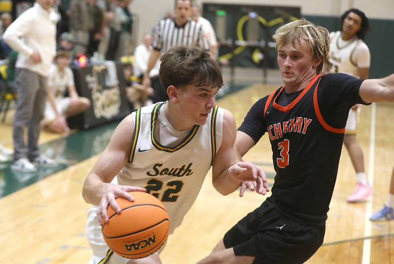 Crystal Lake South's Nick Stowasser drives the baseline against McHenry's Dane Currie during a Fox Valley Conference boys basketball game on Wednesday, Jan. 14, 2026, at Crystal Lake South High School.