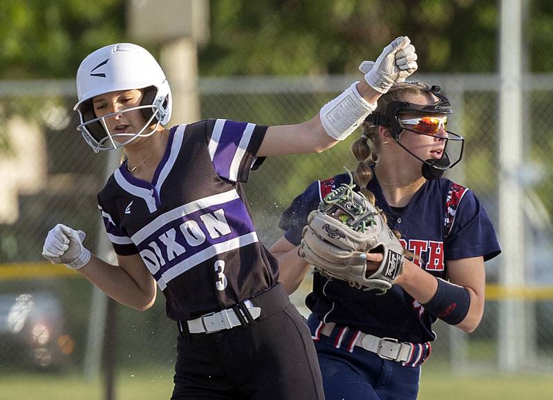 Dixon’s Addy Williams is tagged out by Belvidere North’s Miley Dobbs Tuesday, May 27, 2025, during a Class 3A Regional softball game in Dixon.