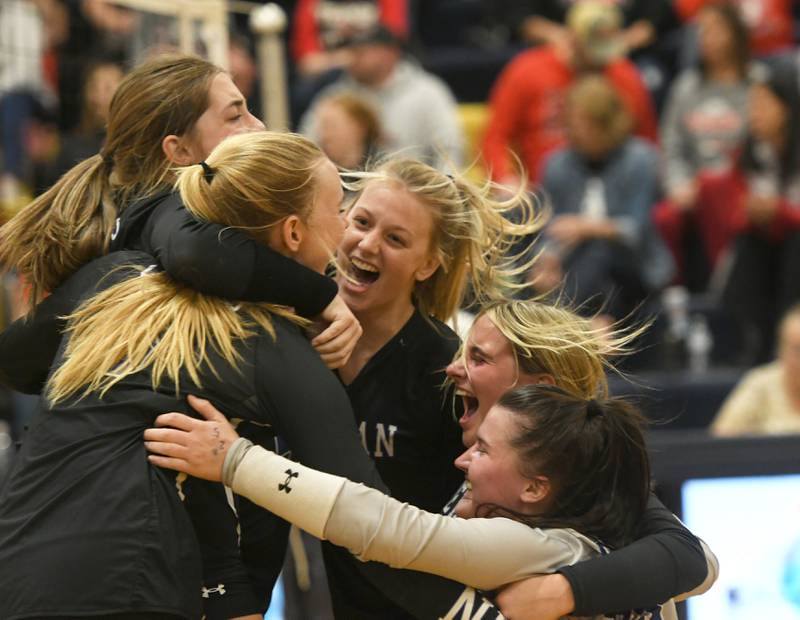 Newman players celebrate after the final point tor win the 1A Polo Regional by downing Fulton in three sets on Thursday, Oct. 27, 2022.