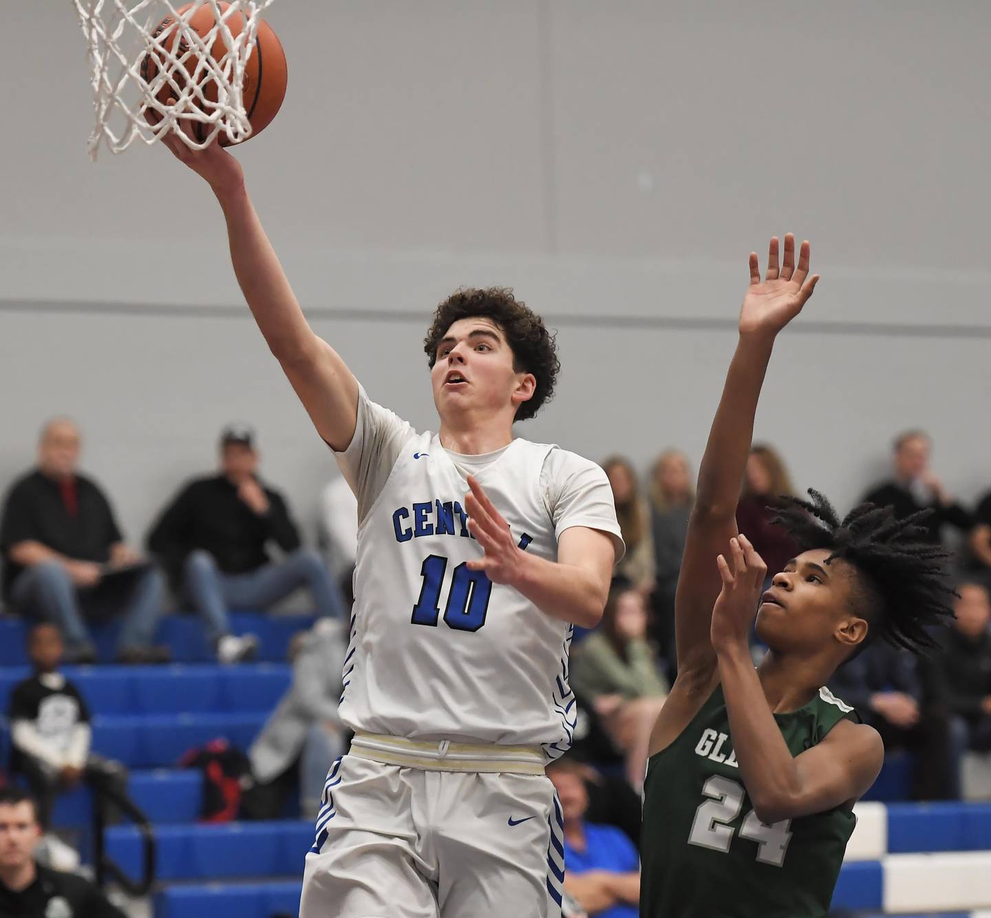 Burlington Central’s Myles Lowe scores ahead of Glenbard West’s TJ Williams in a boys basketball game in Burlington on Wednesday, Jan. 3, 2023.