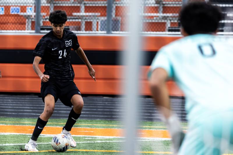 Minooka's Aldo Escobedo makes a move during a varsity soccer home game against Romeoville on Sept. 23, 2025.