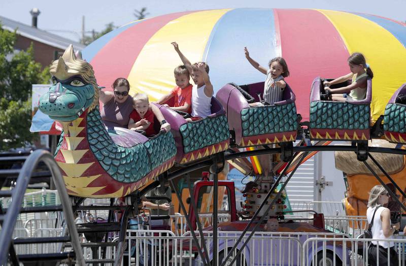 Fest goers ride the Dragon Wagon at the Windmill City Festival Saturday July 9, 2022 at the Peg Bond Center and Batavia Riverwalk in Batavia.