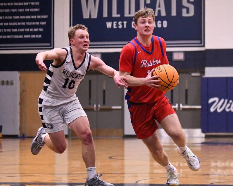 Glenbard South's Mitchell Erickson, right, drives the basket while being defended by West Chicago's Peter Bovey (10) during the game on Friday Jan. 3, 2025, held at West Chicago High School.