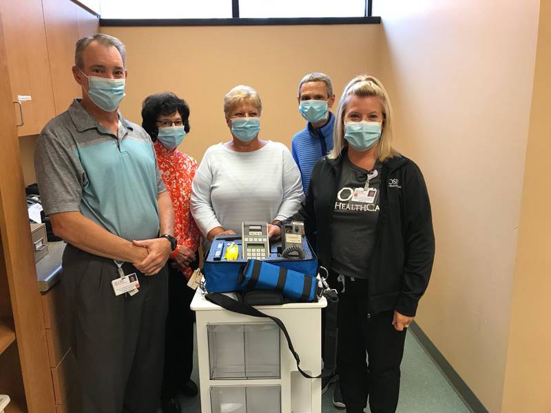 Pictured with the new breath alcohol testing equipment is Scott Hartman, vice president of Support Services; Tree of Lights Committee members Pam Hanson, Kristi Warren, Deb Kirley and Renee Turczyn, Laboratory Services manager.