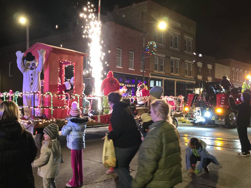 Frosty the Snowman is accompanied by pyrotechnics to conclude the Holiday Magic Lighted Santa Parade on Saturday, Dec. 7, 2024, in Marseilles