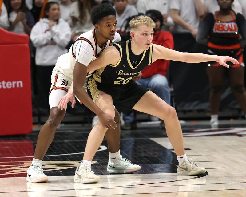 Sycamore's Isaiah Feuerbach tries to post up DeKalb's Derrion Straughter Friday, Jan. 30, 2026, during the FNBO Challenge at the Convocation Center at Northern Illinois University in DeKalb.
