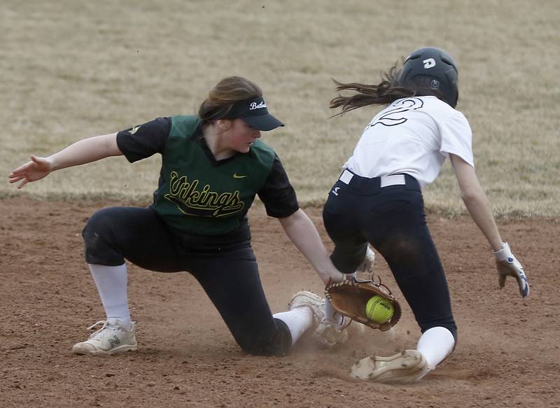 Fremd’s Anna Poss tries to tag Huntley's Reese Hunkins as she slide into second bast during a non-conference softball game Thursday March 17, 2022, between Huntley and Fremd at Huntley High School.