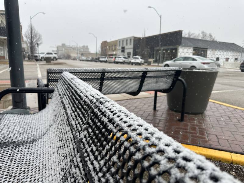 Snow sticks to a bench on the corner of Wright and 1st Streets on Thursday, Jan. 2, 2025 in La Salle.