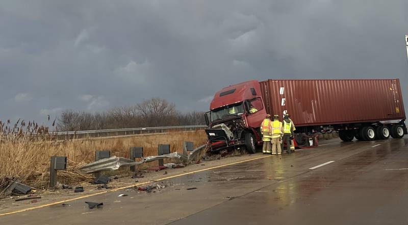 Princeton firefighters work the scene of a semi crash on Interstate 80 on top the Illinois Route 34 overpass on Monday, March 19, 2025 in Princeton. The accident happened  in the eastbound lane of Interstate 80 shortly after 5p.m. Illinois State Police also responded to the incident. Traffic was down to one-lane for about an hour.