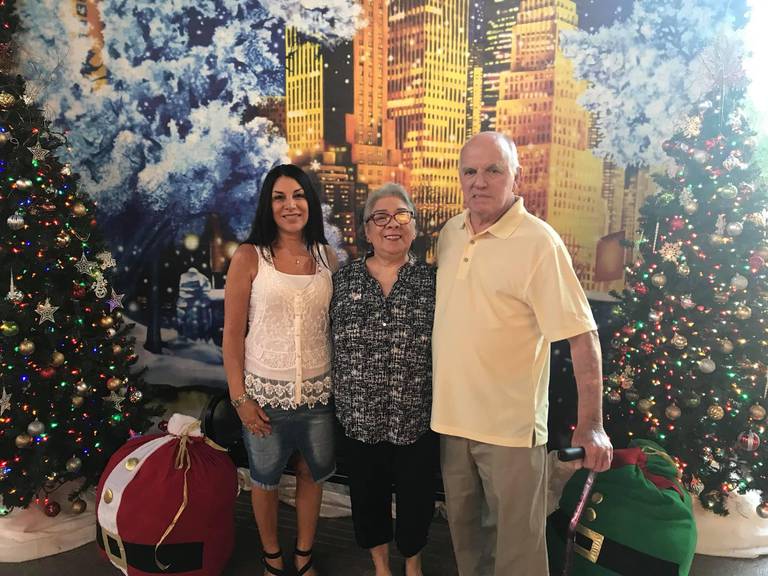 Linda DiJoseph, of Wonder Lake, left, with her parents, Jim and Gloria Donahue, during a visit over the Christmas season. The Donahues are stuck in their second-floor condo with no way to get out following Hurricane Ian.