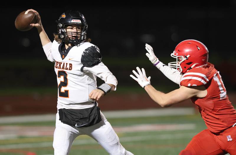 DeKalb's Cole Latimer throws gets rid of the ball ahead of the Naperville Central pass rush during their game Friday, Oct. 6, 2023, at Naperville Central High School.