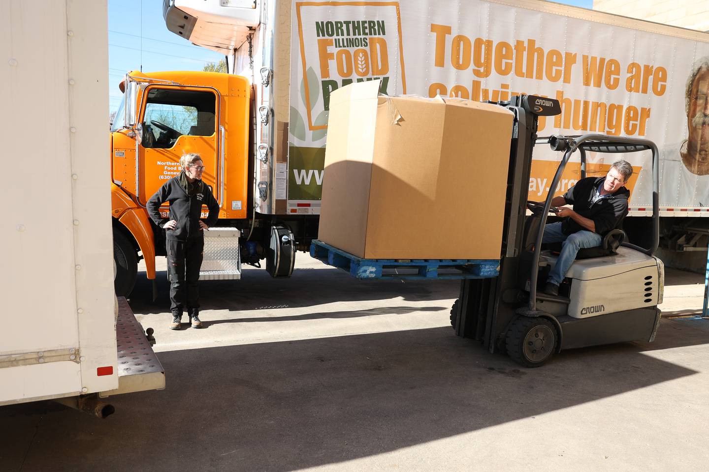 Steve Harold, processing coordinator at the Northern Illinois Food Bank South Suburban Center in Joliet, loads a pallet of meat into a truck for Rainah Runty of Big Wolf Ranch Rescue in Lockport on Tuesday, Nov. 12, 2024 in Joliet.