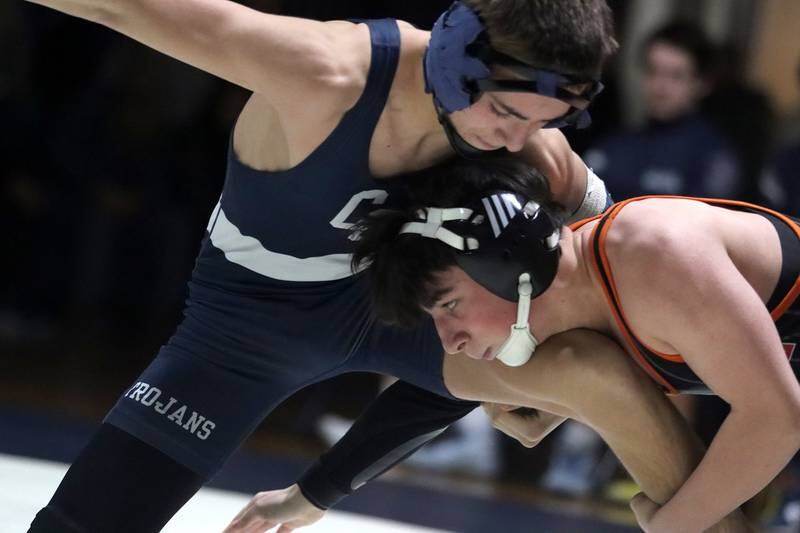 Crystal Lake Central’s Daniel Snow, right, battles Cary-Grove’s Levi Ardente at 132 pounds in varsity wrestling Thursday, Dec. 19, 2024 at Cary-Grove High School in Cary.
