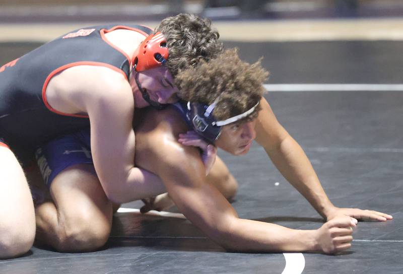 Bradley-Bourbonnias's Lee Shawn wrestles Marquette's Marcus Baker on Wednesday, Jan. 14, 2026 in Bader Gymnasium at Marquette Academy.