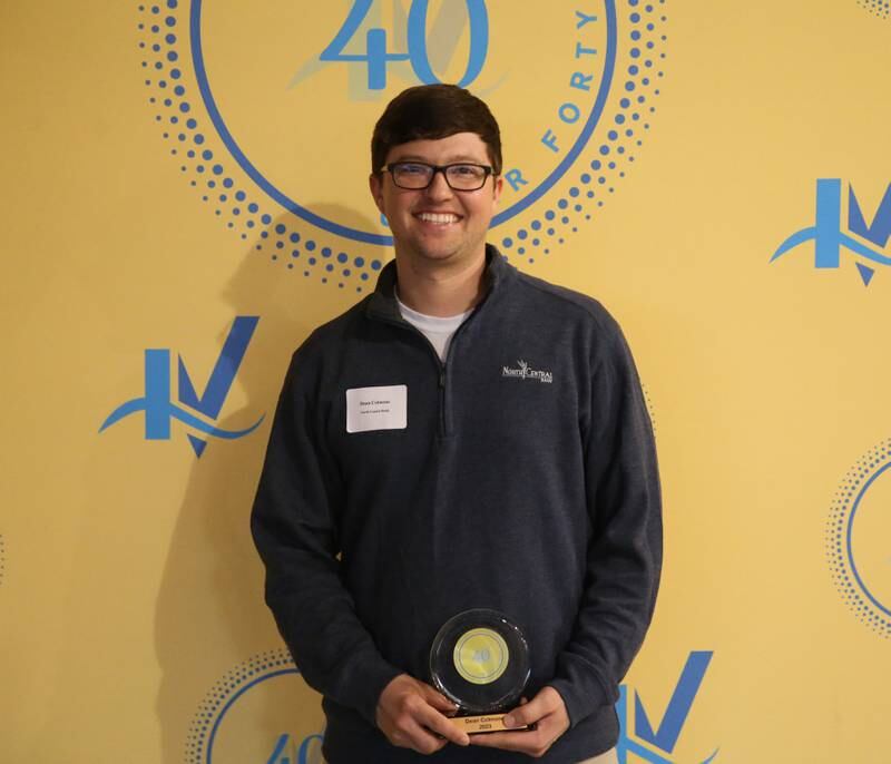 Dean Colmone poses for a photo with his award during the 40 Under Forty awards banquet on Thursday, March 21, 2024 at Westclox in Peru.
