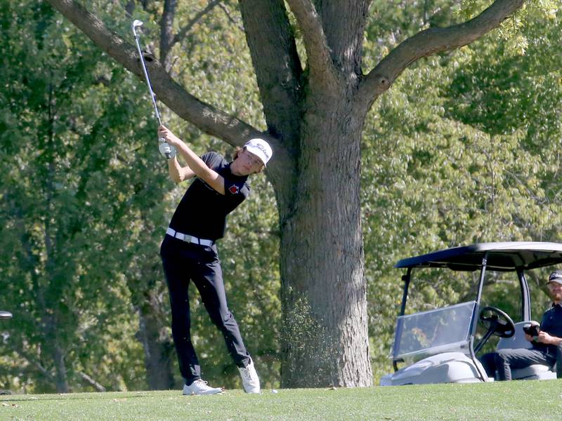 Hall's Noah Plym hits his ball toward the 8th hole during the Class 1A golf meet on Wednesday, Oct. 2, 2024 at Spring Creek Golf Course in Spring Valley.